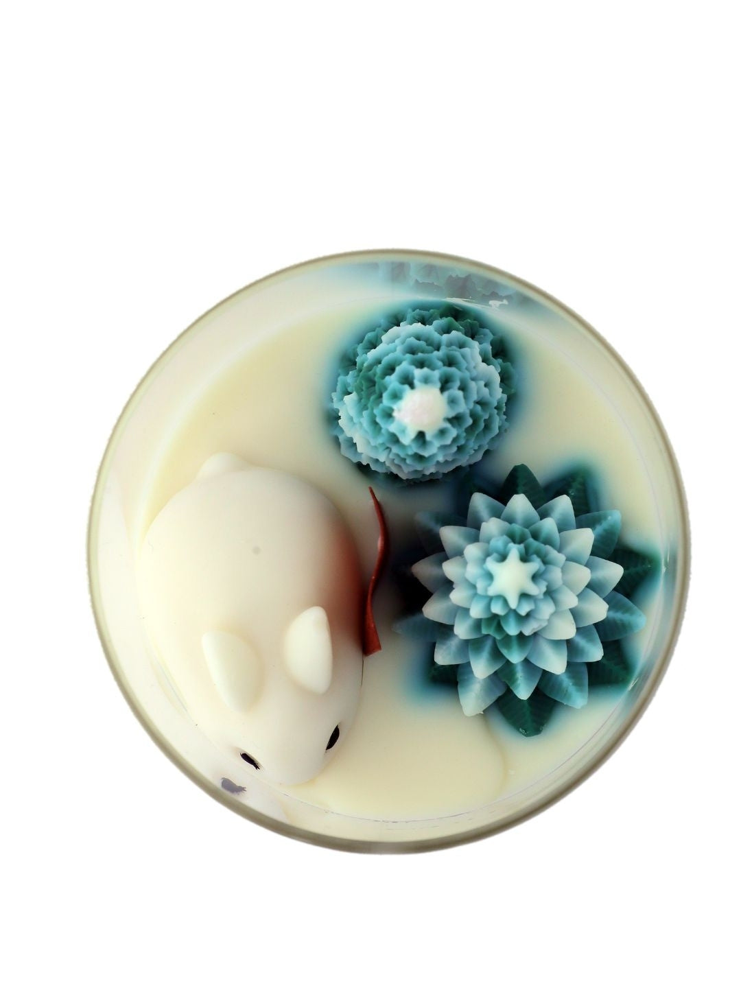 top view of Frost and Fur Candle Jar cleary shows rabbit, pine trees and s-shaped wooden wick
