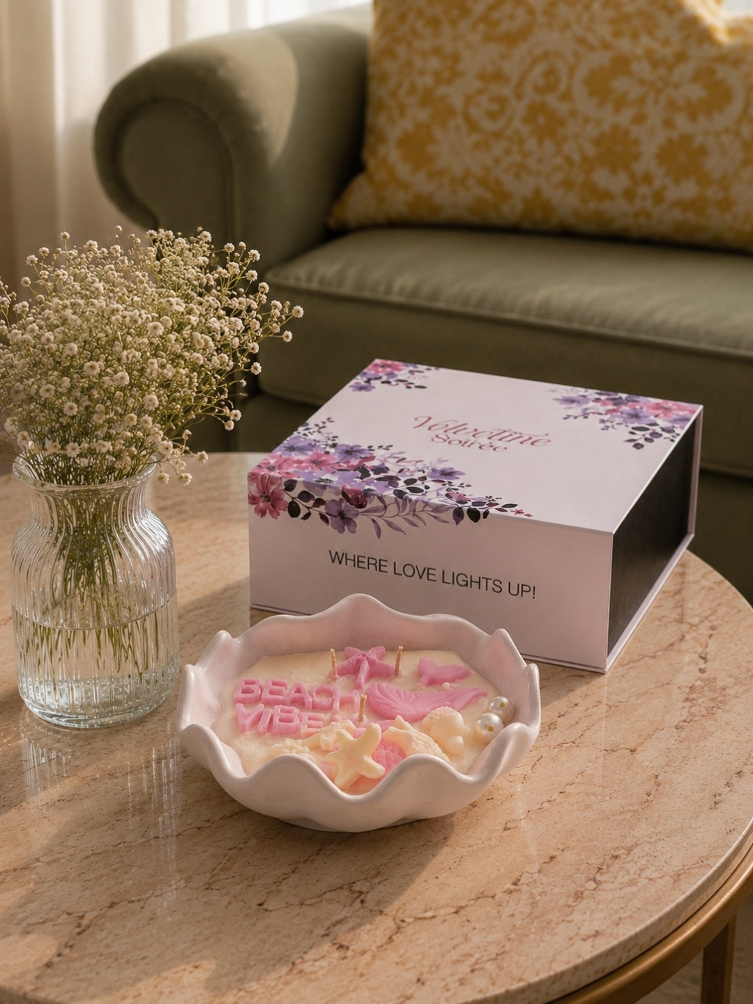 Conch shaped candle jar with its Velvetine Soirée gift box on a round table.