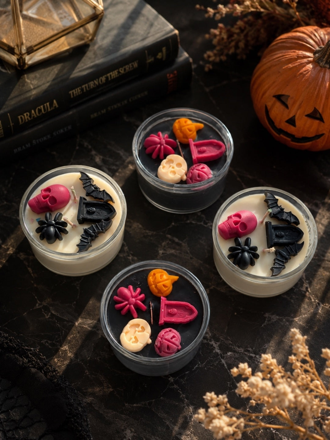 haunted Whimsy by Velvetine Soirée showing 4 halloween themed candles jars 